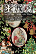 Iron Orchid Designs Christmas transfer sheet with vintage-style illustrations on a black background.