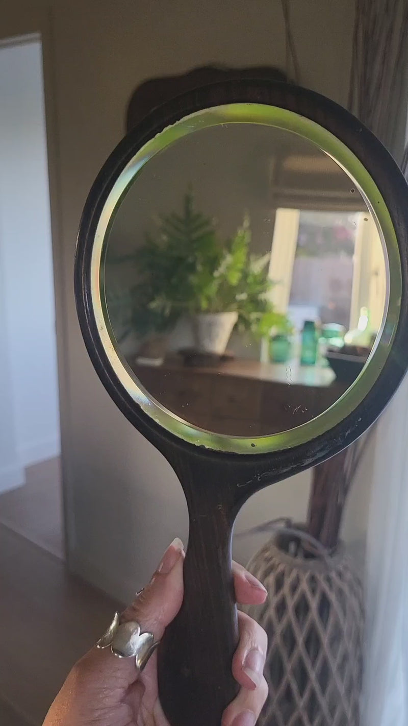 Video of vintage ebony framed hand mirror