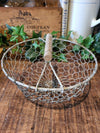 Decorative wire basket with wooden handle